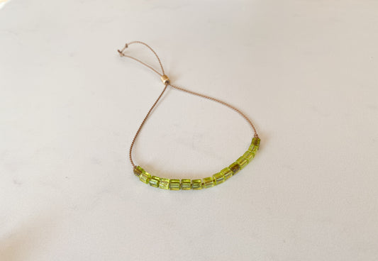 Green Glass Beads on Beige Silk Cord